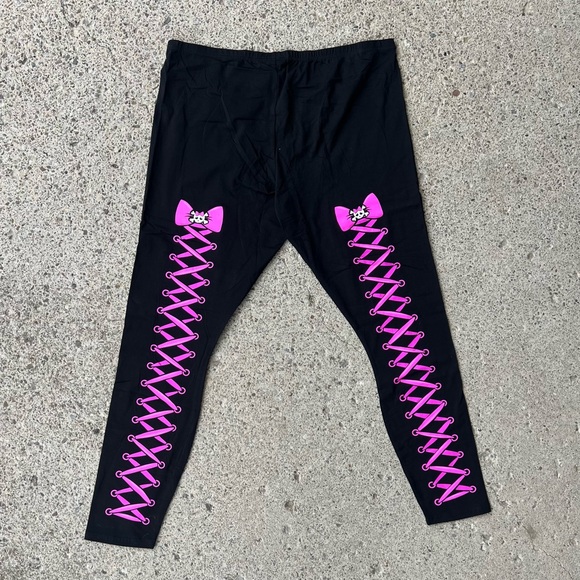 Dolls Kill Pants - Leggings with pink lace up & skulls with bow